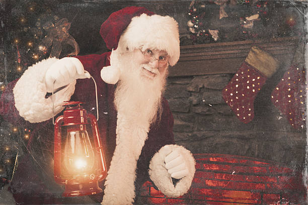 pictures of Real Santa Claus looking who Is home pictures of Real Santa Claus carrying a lantern light sneaking around the house. santa claus expressions shhh stock pictures, royalty-free photos & images