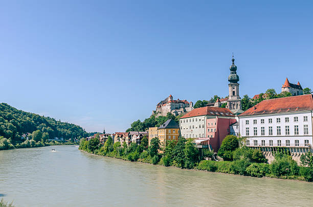 Castle and old town of Burghausen. Photographed from a public place in Austria. Burghausen is a small town in Bavaria at the border with Austria. In the foreground you can see the Salzach River, which forms the border with Austria.