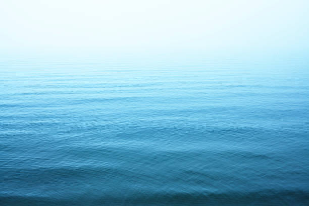 Ripples on blue water surface Same photos and more you can find here: lake stock pictures, royalty-free photos & images