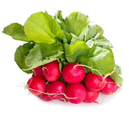 red radish with leaves isolated on white