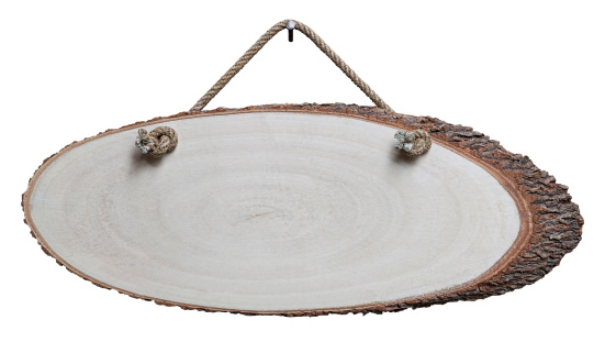 Trunk cross section wood signboard, hanging by old rope from a nail, composite image, isolated on white, clipping path included.