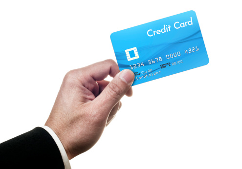 Businessman holding credit card.More business images: