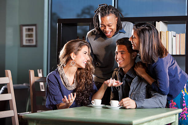 istock College students hanging out in coffee shop 175530528