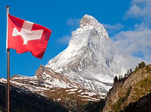 The Matterhorn as seen from Zermatt and the Flag of Swiss Confederation.