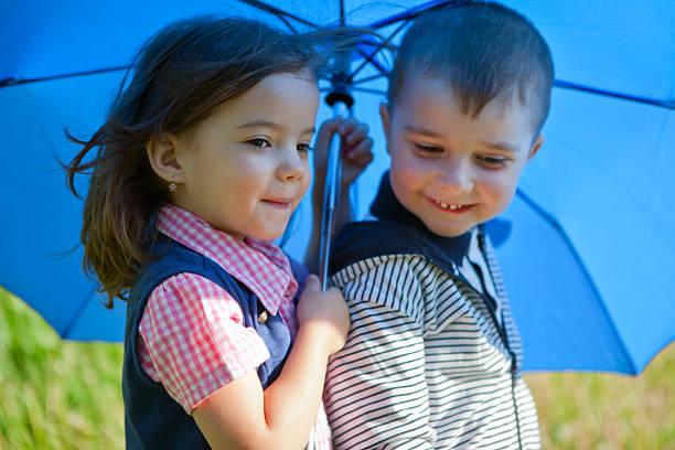 istock Two friends under an umbrella 175531198