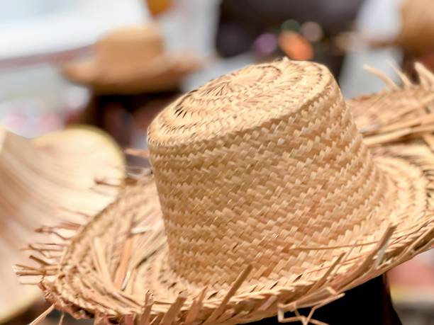 istock straw hats at a market. 1755313746