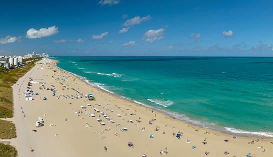 Miami Beach city with high luxury hotels and condos and sandy beachfront.