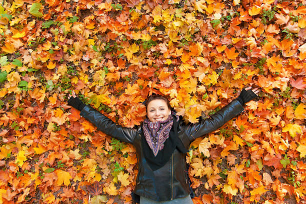 istock Woman  laying on autumn leaves. 175532082