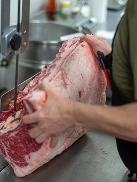 istock Isolated close up high resolution image of beef/ meat cutting and preparation process in a boutique butcher shop- USA 1755325102