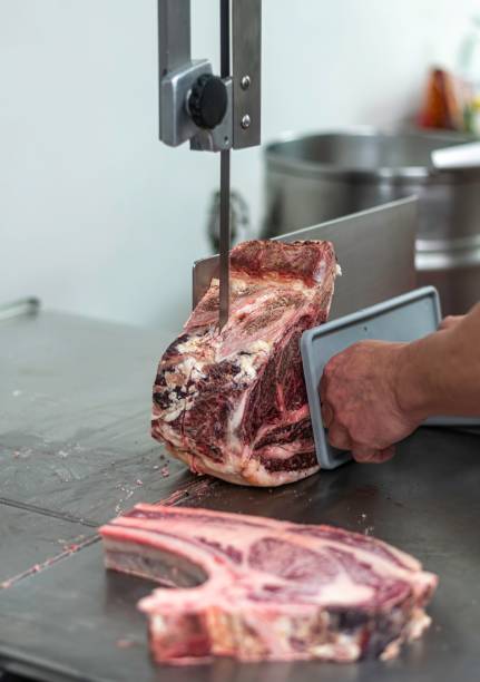 istock Isolated close up high resolution image of beef/ meat cutting and preparation process in a boutique butcher shop- USA 1755325125