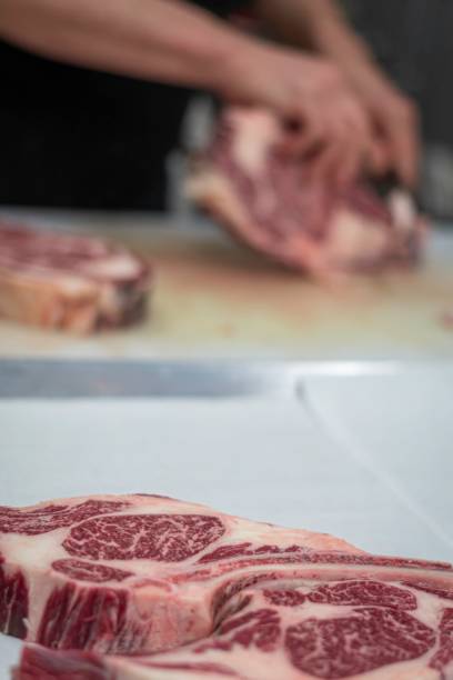 istock Isolated close up high resolution image of beef/ meat cutting and preparation process in a boutique butcher shop- USA 1755325126