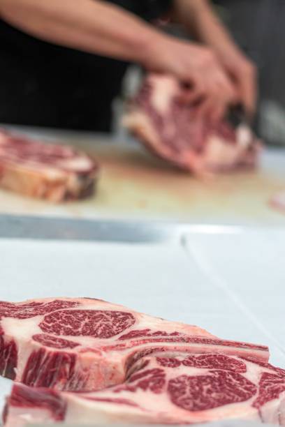 istock Isolated close up high resolution image of beef/ meat cutting and preparation process in a boutique butcher shop- USA 1755325128