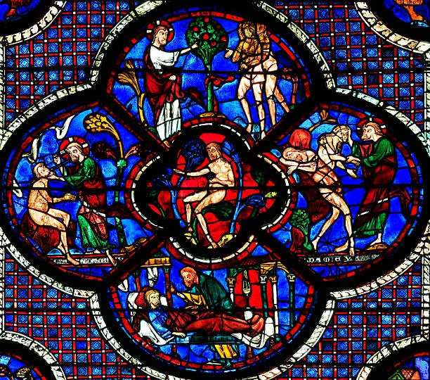 "Part two of stained glass window Parable of the Good Samaritan at the cathedral Notre Dame, Chartres. This window is one of the row lower windows at the south aisle of the church.The window is made in the 13 th century"