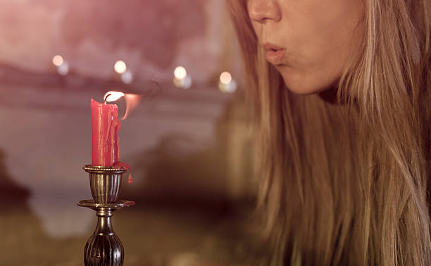 istock Woman blowing out the candle 175533238