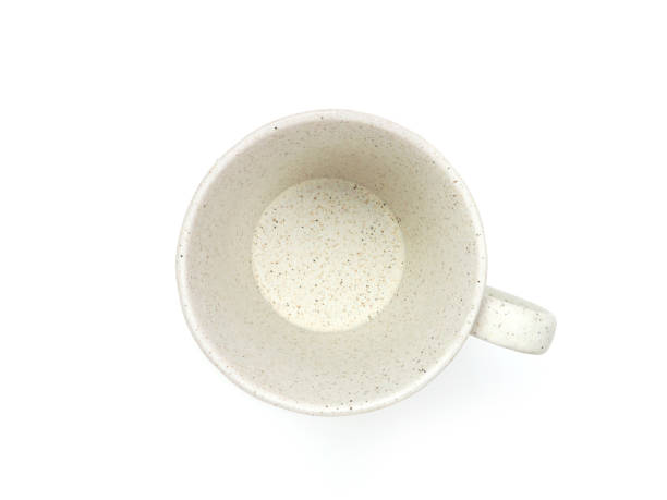istock Empty beige mug with dotted isolated on white background. Use for home or restaurant, food design. Concept kitchen utensils and tableware. Top view, flat lay. 1755335943
