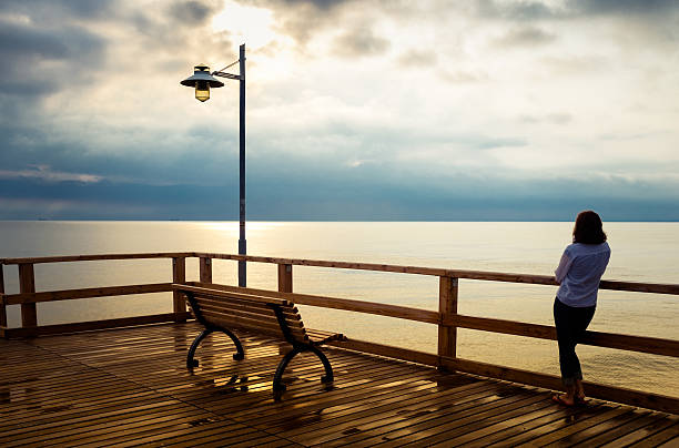 istock Woman on jetty 175534746
