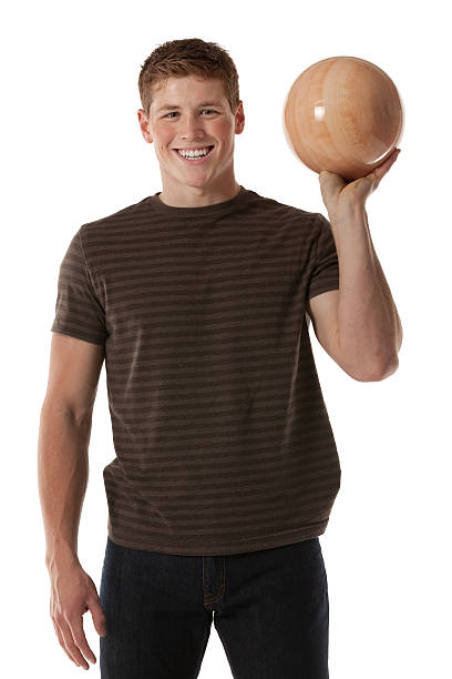 счастливый мужчина держит шар для боулинга - bowling isolated sportsman vertical стоковые фото и изображения