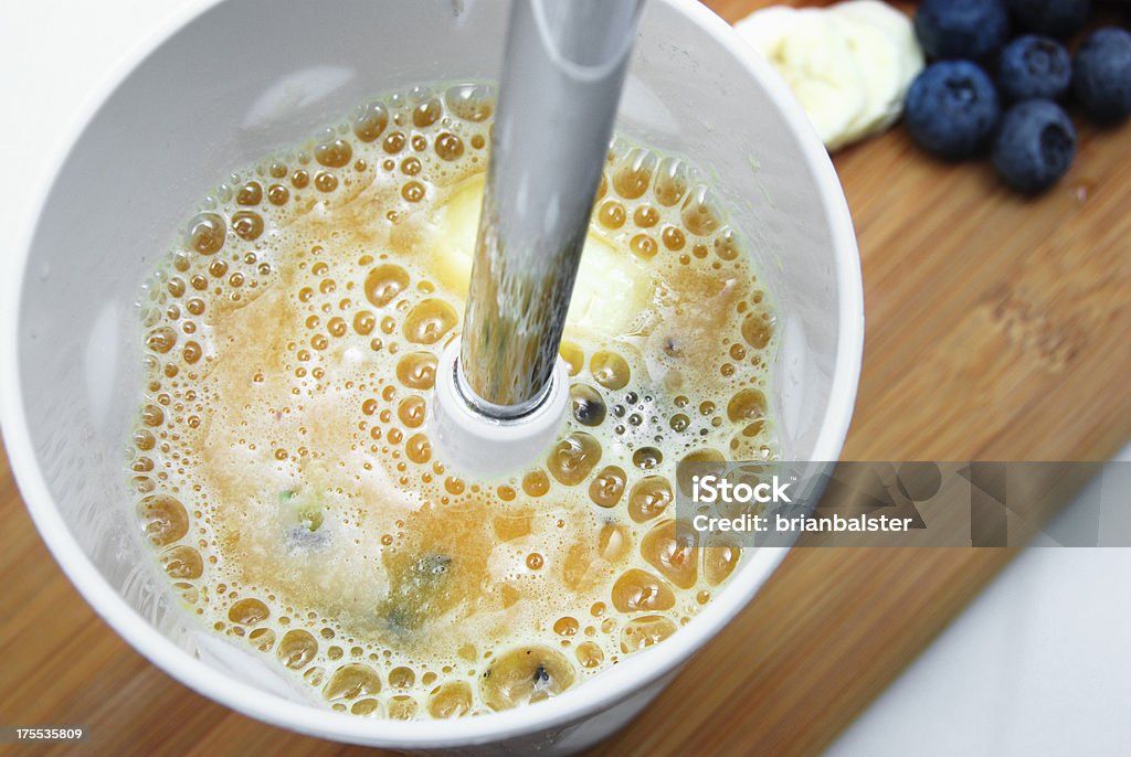 Blender and Smoothie Blending a delicious fruit smoothie. Above Stock Photo