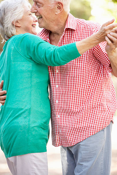 istock Senior Couple Dancing In Countryside Together 175536044