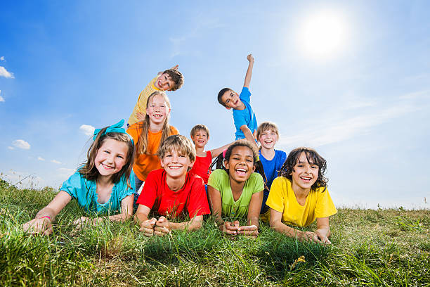 istock Happy kids lying in field and looking at camera. 175536994