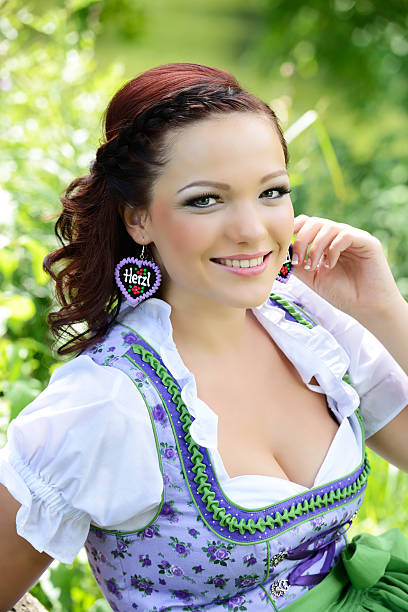 istock Happy Blue Dirndl Woman in Meadow 175537087