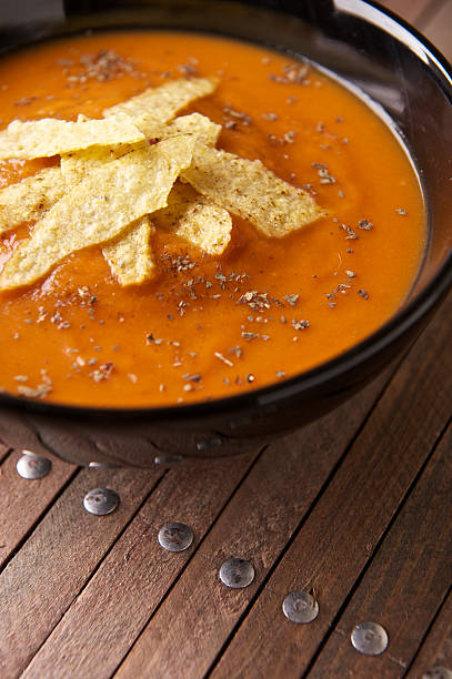 Tomato and Basil Soup with Tortilla stock photo