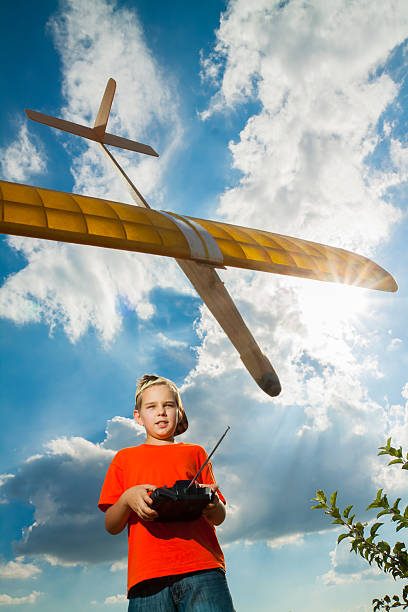 istock Little boy playing with airplane 175537898