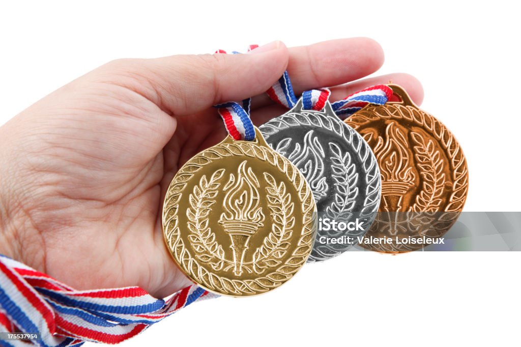 Trzy medale w rękę - Zbiór zdjęć royalty-free (Białe tło)