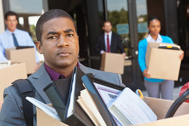 istock Angry people leaving office holding boxes after being fired. 175538062