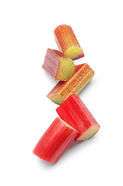 Small group of rhubarb chunks isolated on white.