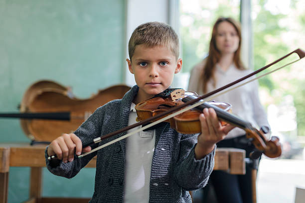istock Young Child Learning to Play Violin 175538326