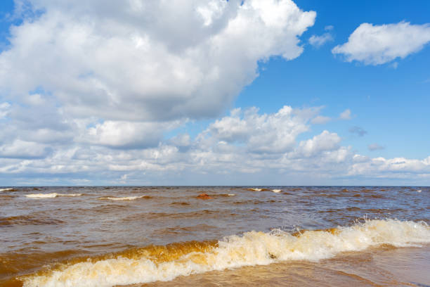 istock White clouds in the blue sky over the lake. 1755383958