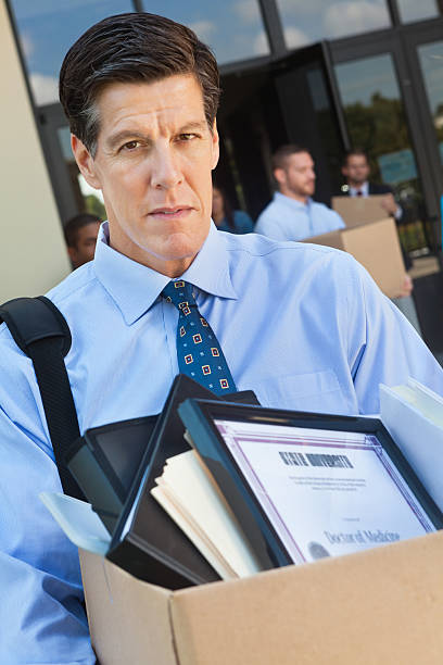 istock Mature unemployed man leaving office after layoff or being fired 175538530
