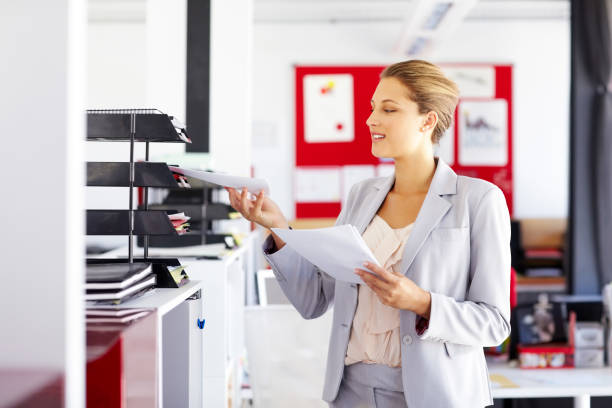 istock Businesswoman Keeping Documents In Paper Tray 175538794