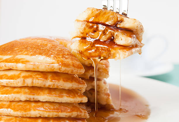 Fork in pancakes stock photo