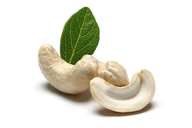3 cashews on white background including full and horizantal half pieces.