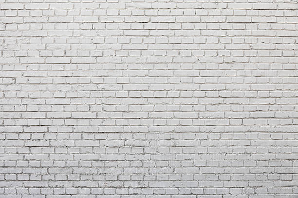 white brick wall - concret stock-fotos und bilder