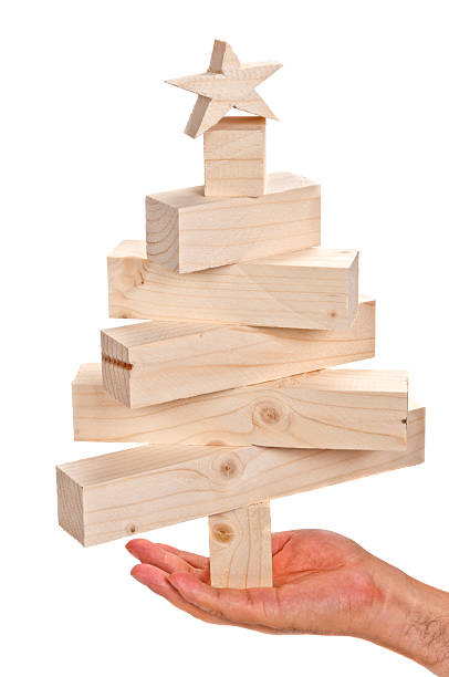 istock Stacked lumbers of a christmas tree in human hand 175539257
