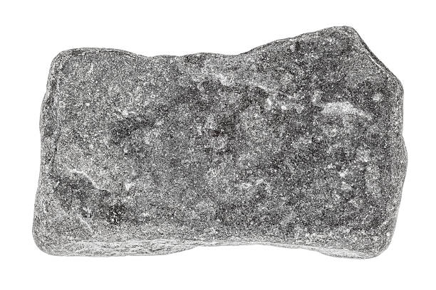 Grey stone isolated on white Grey stone isolated on white. Focus is front to back. stone object stock pictures, royalty-free photos & images