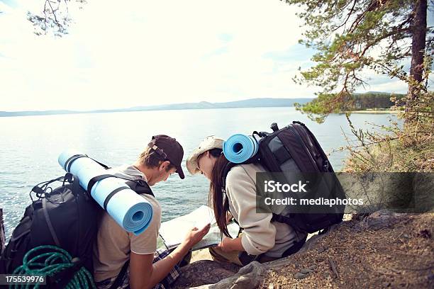 Hikers Looking At Map Stock Photo - Download Image Now - 20-24 Years, 20-29 Years, Activity