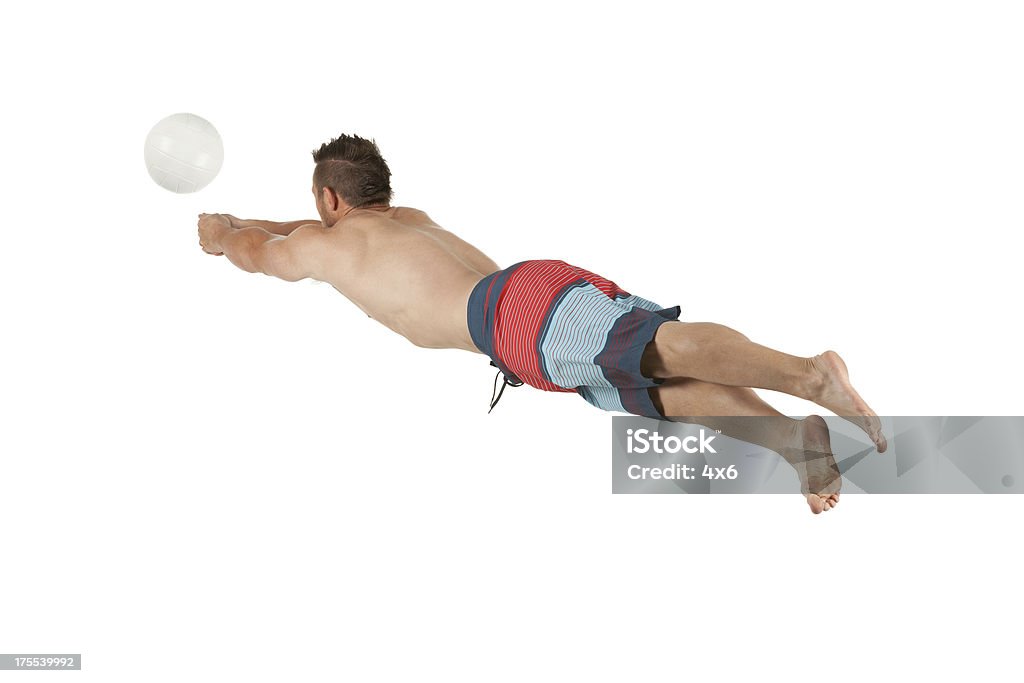 Profil d'un homme jouant de volley-ball de plage - Photo de Activité libre de droits