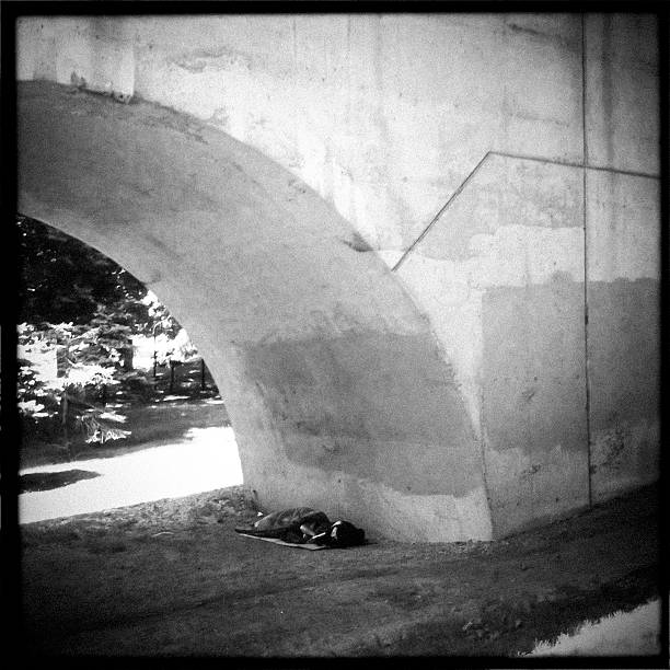 Homeless under a bridge stock photo
