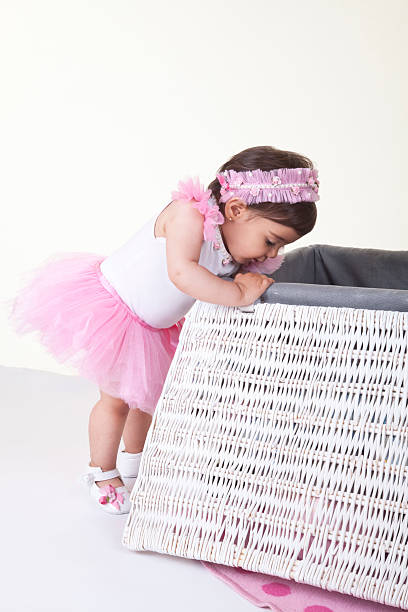 istock happy baby in tutu with toy box 175541458