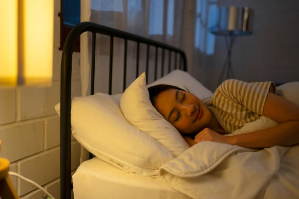 istock A woman sleeping at night. 1755414810