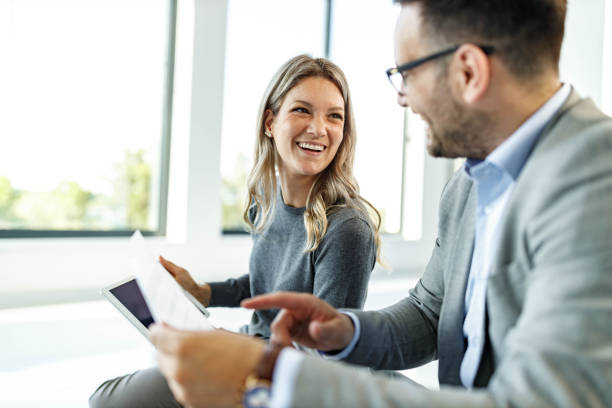 istock Happy business colleagues talking while working in casual office. 1755416405