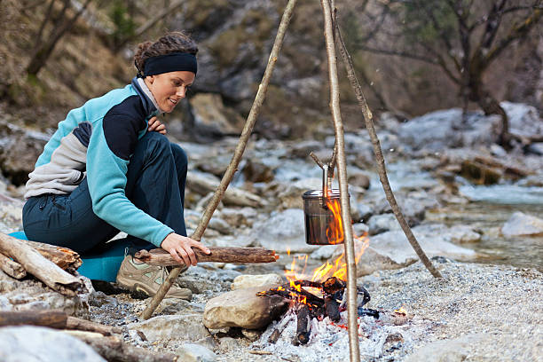Preparing venison outdoors on a Do It Yourself cooking chimney