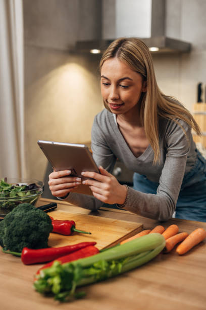 istock woman prepares food in kitchen 1755422895