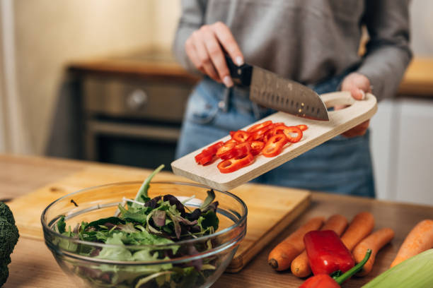 istock woman prepares food in kitchen 1755422901