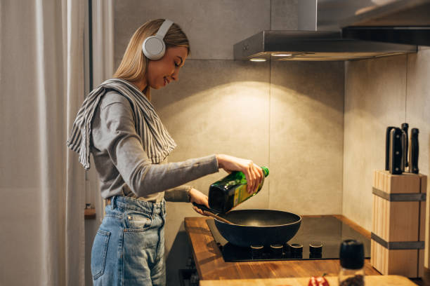 istock woman prepares food in kitchen 1755422930