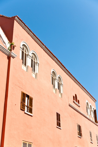 colonial architecture: orange pastel facade in sunny afternoon